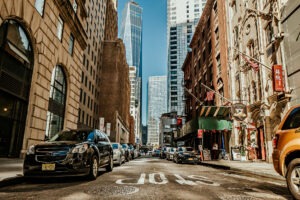 street view in New York with cars and brick buildings