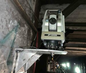 An automated motorized total station installed on a construction site by Saltus Construction Monitoring Services.