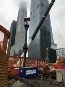 An Automated Motorized Total Station used for Optical Structural Surveying services on an active construction site in NYC.