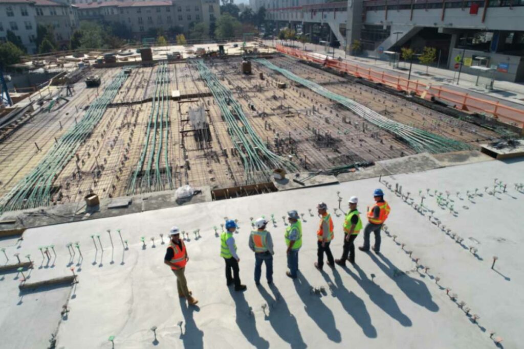 A construction team consulting on an active construction site.