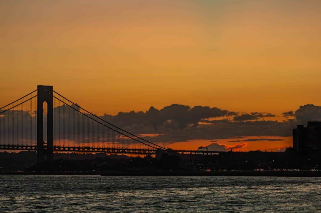 The Verrazano–Narrows Bridge in New York, NY, at sunrise.