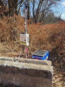 Dust monitoring equipment set up by Saltus technicians in the area around an active construction site.